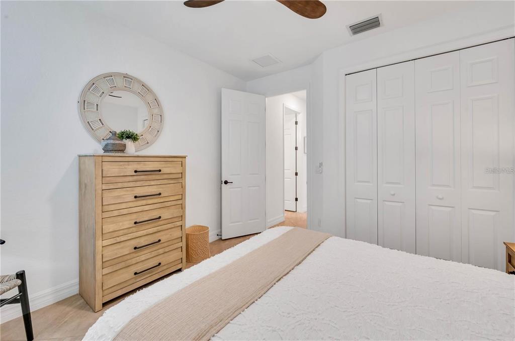 5822 Brandon Run Bradenton, FL 34211 - Photo 14 of 34 a bedroom with a bed and a dresser