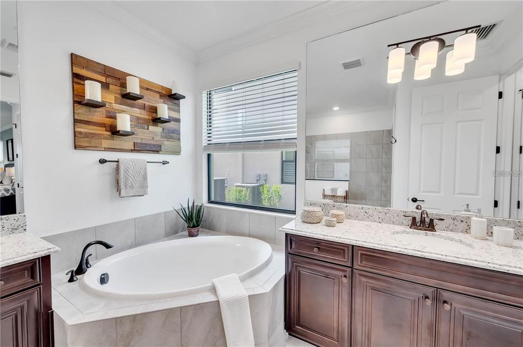5822 Brandon Run Bradenton, FL 34211 - Photo 17 of 34 a bathroom with a sink and a mirror