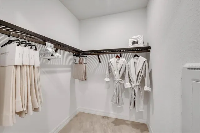 a dining room with furniture a rug and a chandelier