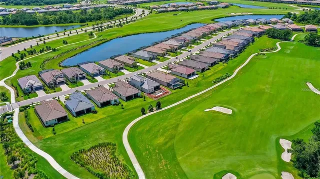 a view of a golf course with a lake view