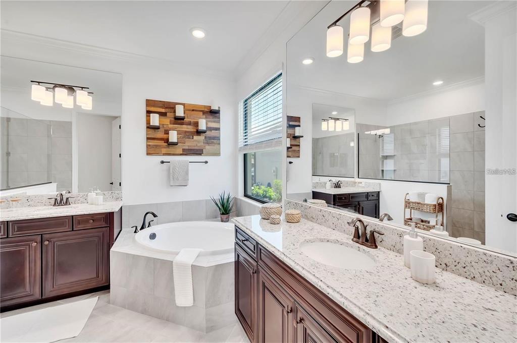 5822 Brandon Run Bradenton, FL 34211 - Photo 23 of 34 a bathroom with a granite countertop sink mirror and double