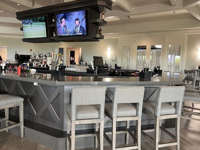 5822 Brandon Run Bradenton, FL 34211 - Photo 30 of 34 a kitchen with a dining table chairs cabinets and stainless steel appliances