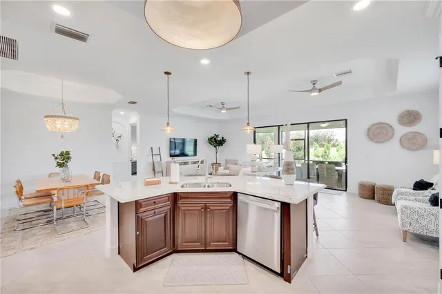 a kitchen with stainless steel appliances granite countertop a stove refrigerator and cabinets