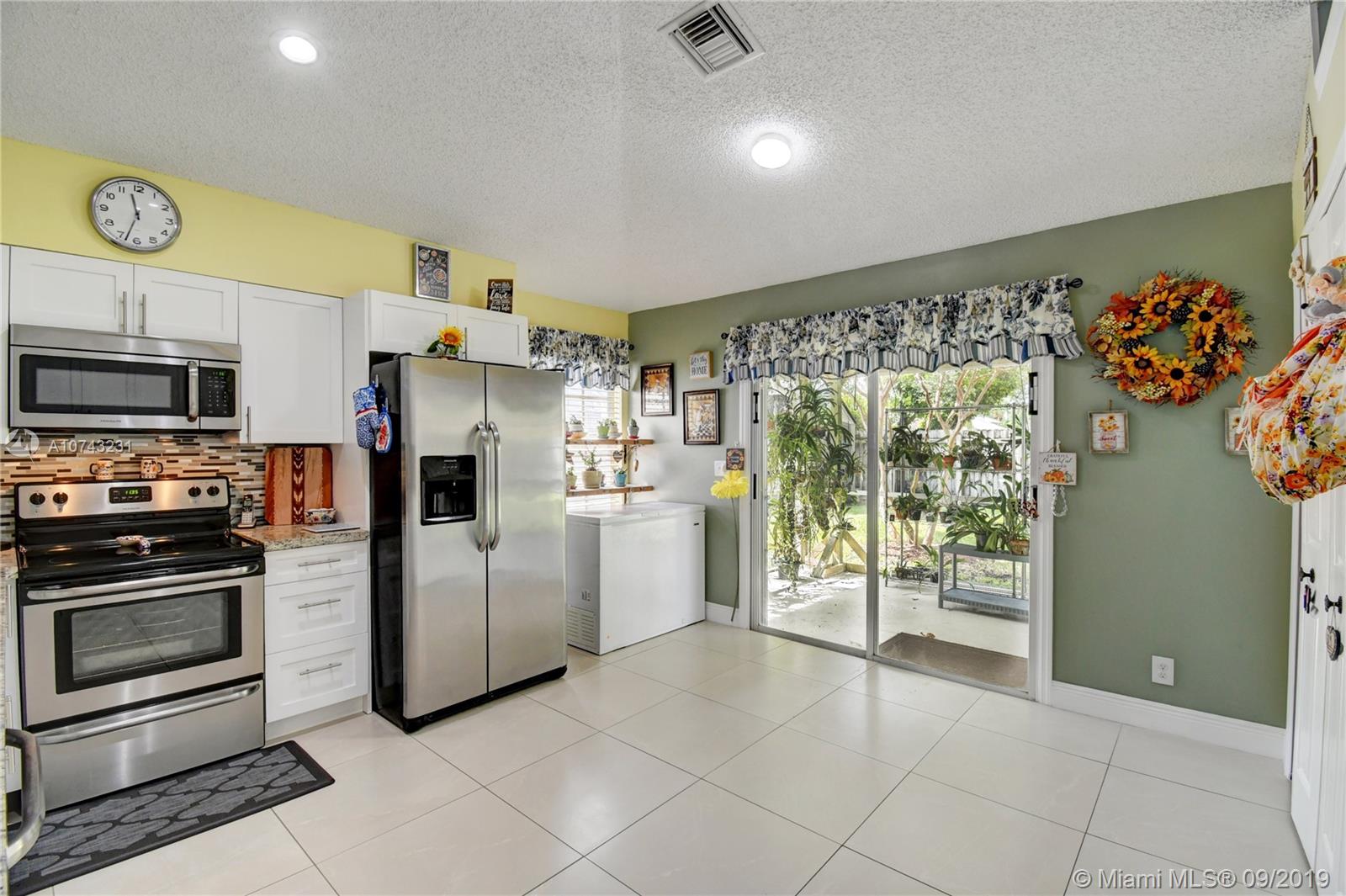 1033 Aviary Road Wellington, FL 33414 - Photo 7 of 36