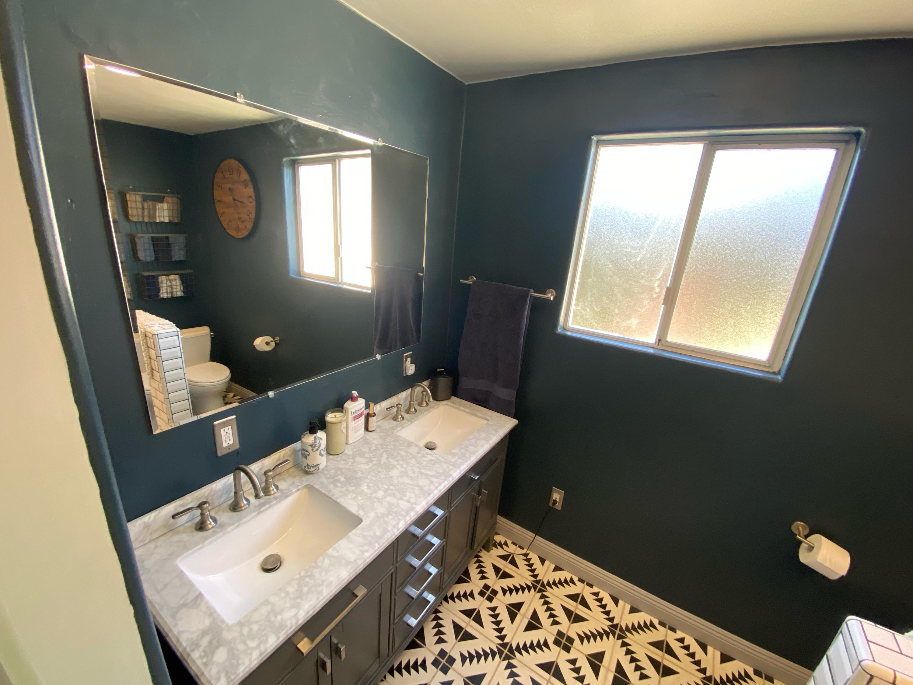 575 Pine Street Solvang, CA 93463 - Photo 13 of 22 a bathroom with a sink vanity and a mirror