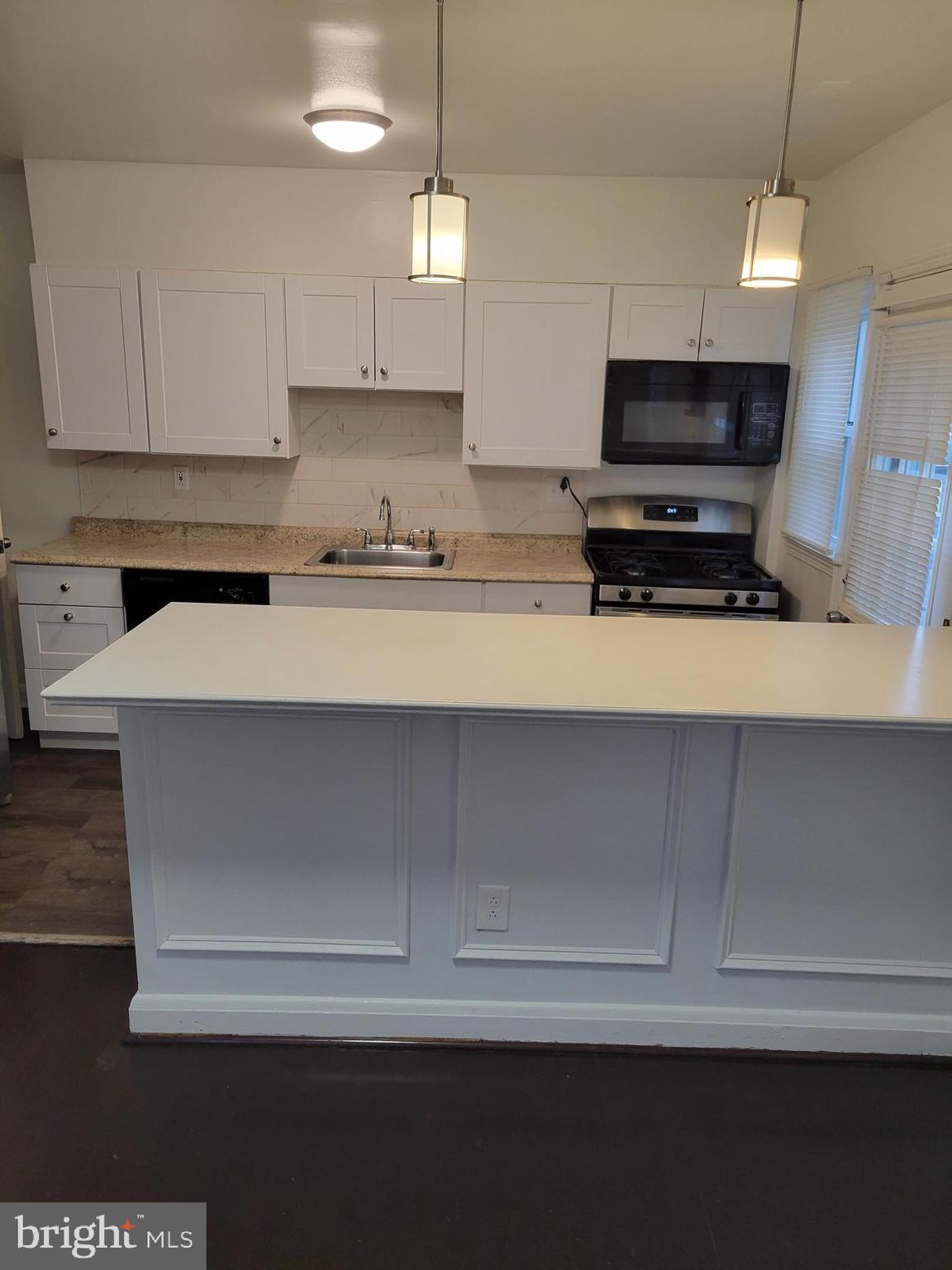 3505 Templar Road Randallstown, MD 21133 - Photo 36 of 40 a kitchen with kitchen island sink and refrigerator