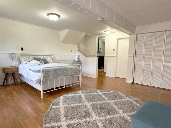 a bedroom with a bed and a table in it