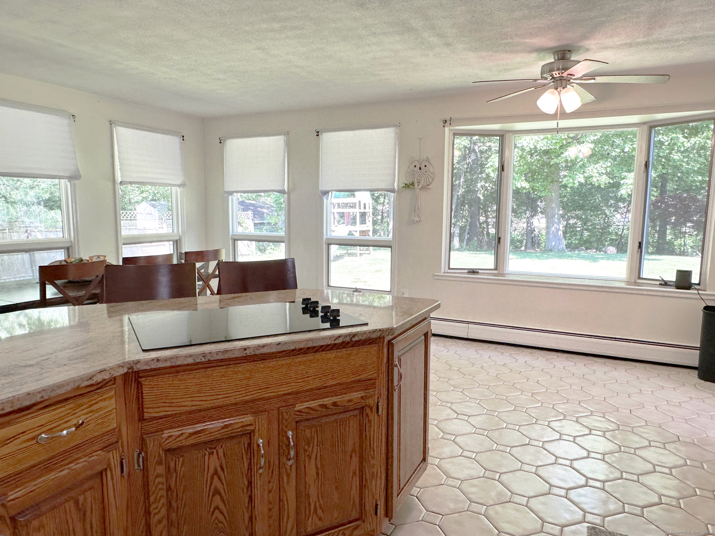 39 Mohawk Drive Norwalk, CT 06851 - Photo 14 of 37 a kitchen with granite countertop a sink and a stove