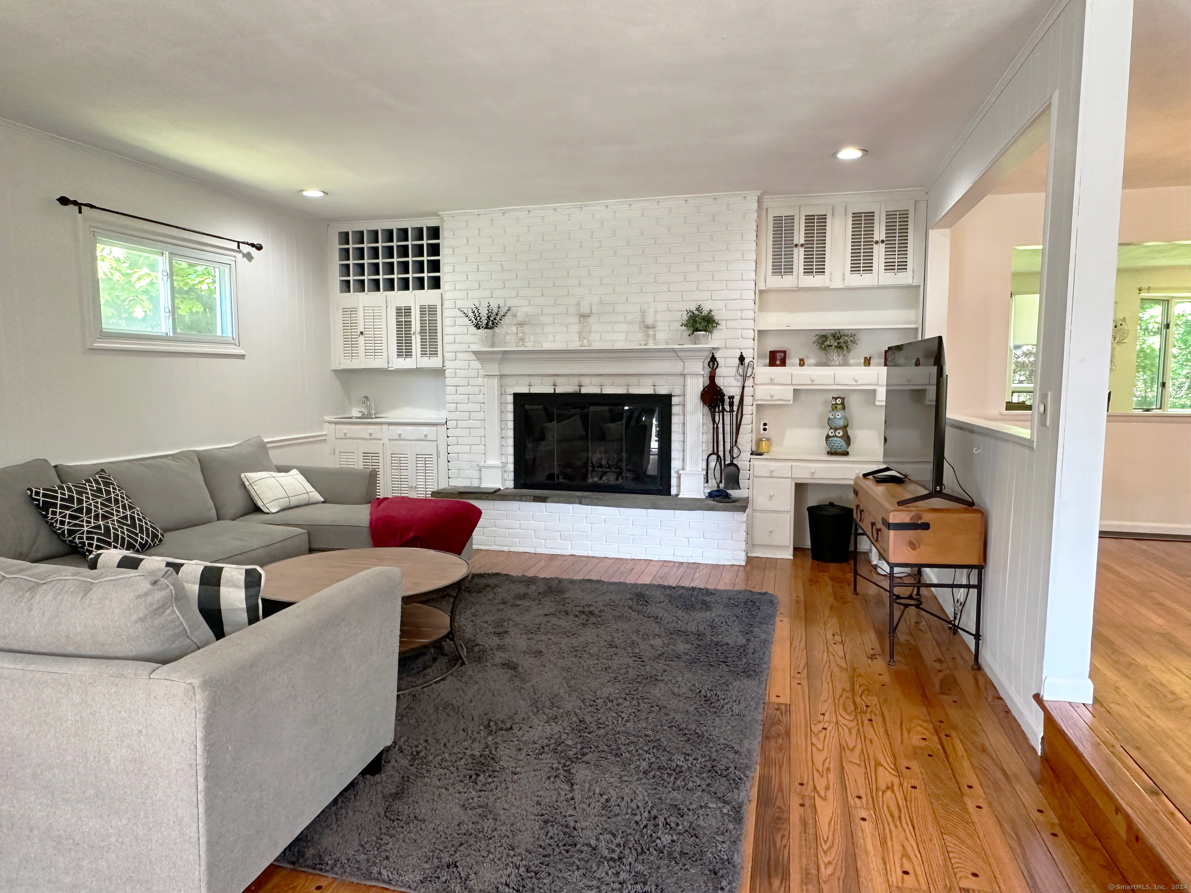 39 Mohawk Drive Norwalk, CT 06851 - Photo 2 of 37 a living room with furniture and a fireplace