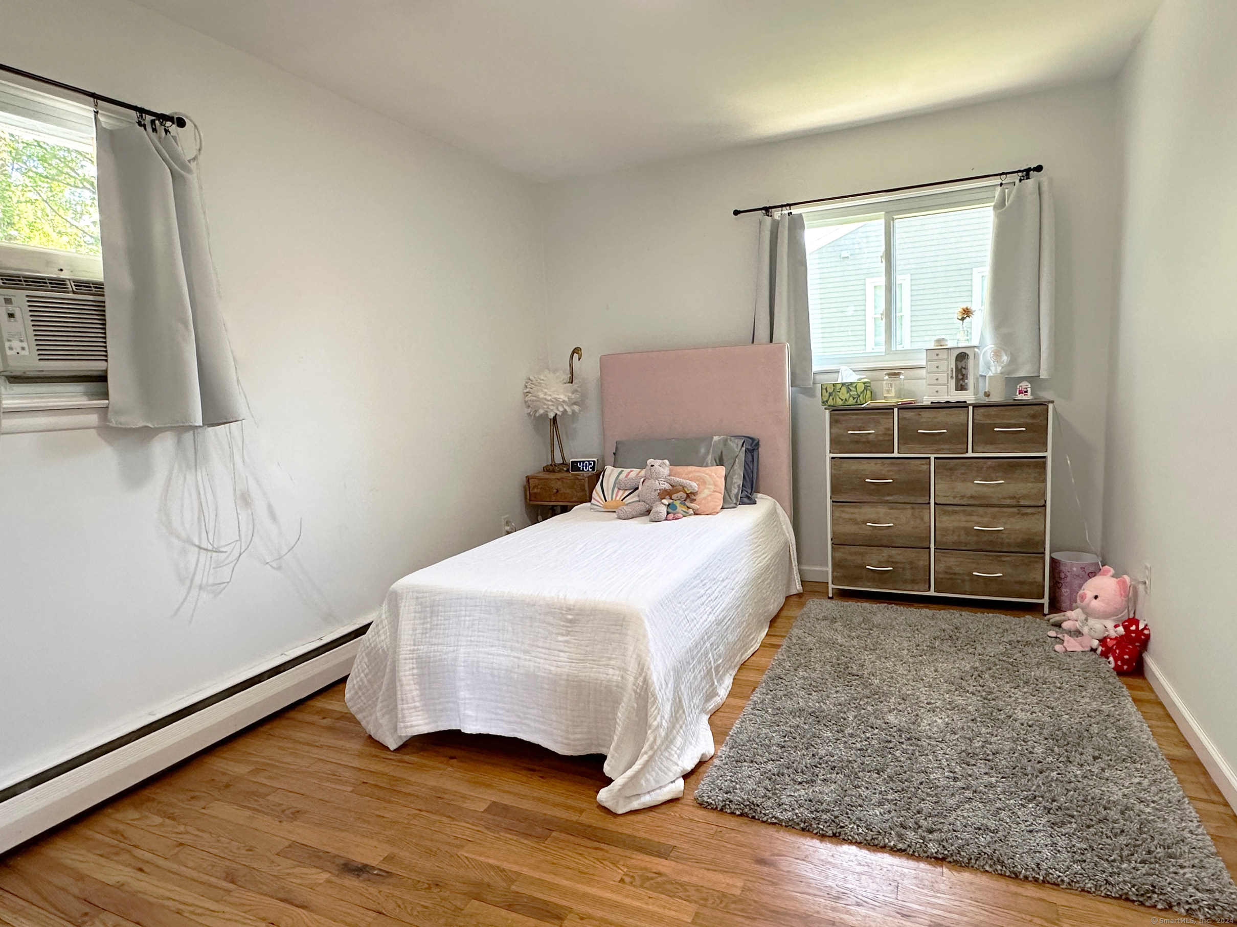 39 Mohawk Drive Norwalk, CT 06851 - Photo 23 of 37 a bedroom with a bed and a window