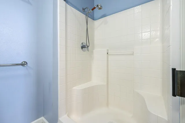 a view of a hallway with washer and dryer