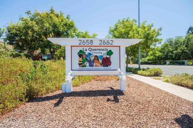 a open kitchen with stainless steel appliances kitchen island granite countertop a stove and a sink