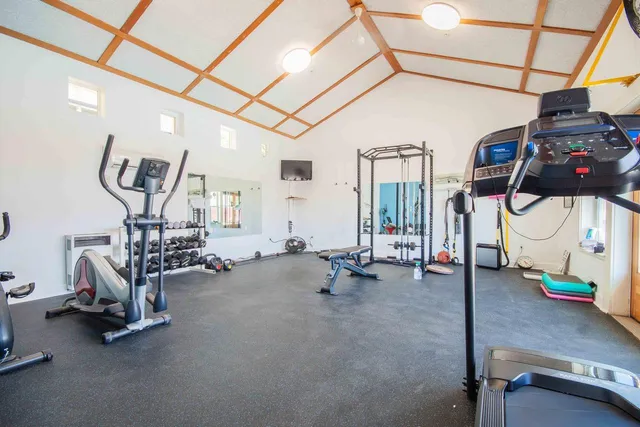 a view of a swimming pool with a bench and floor