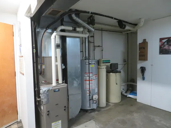 a kitchen with stainless steel appliances granite countertop a refrigerator and a stove