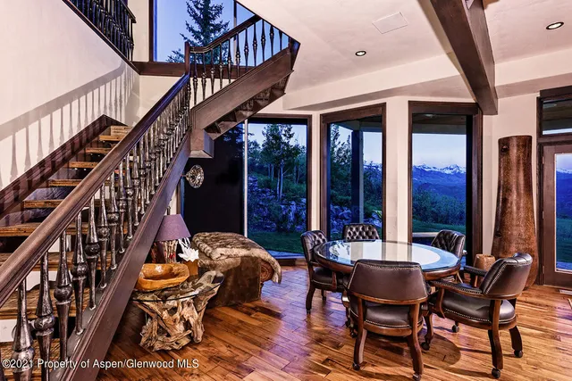 a view of an chairs and tables in the balcony