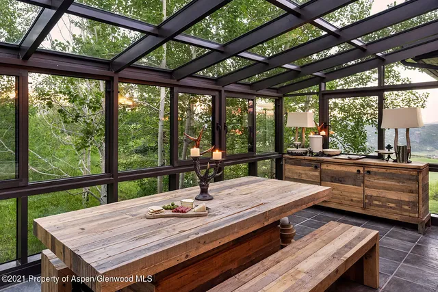 a view of a dining room with furniture window and outside view