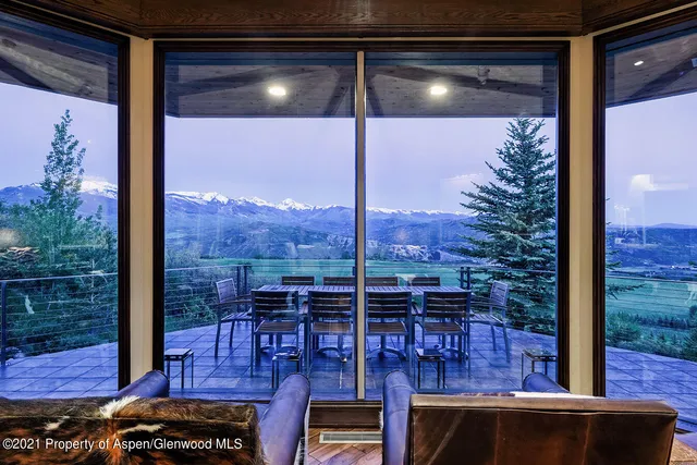 a view of a balcony with chairs