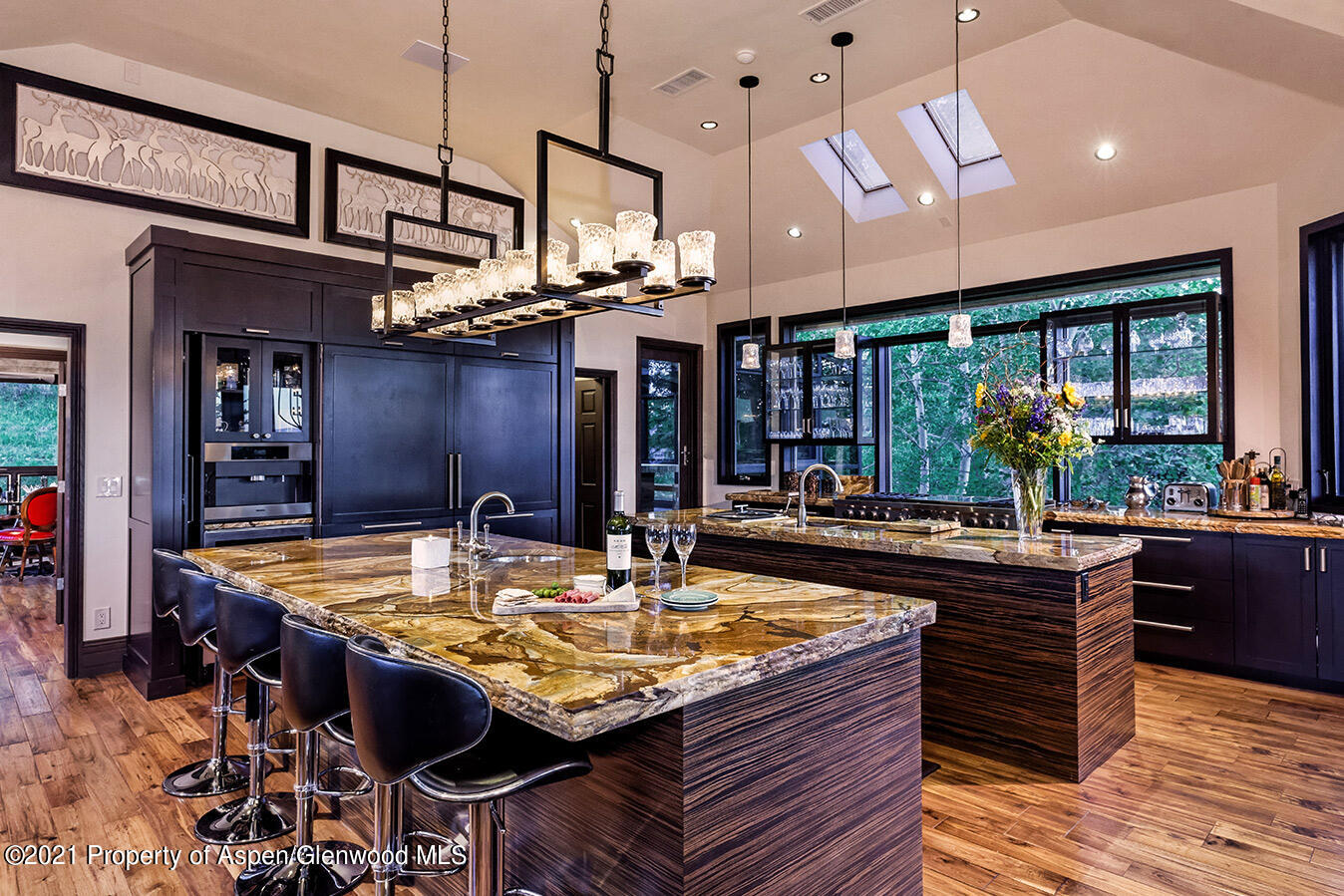 572 North Starwood Road Aspen, CO 81612 - Photo 9 of 26 a kitchen with a table and chairs in it
