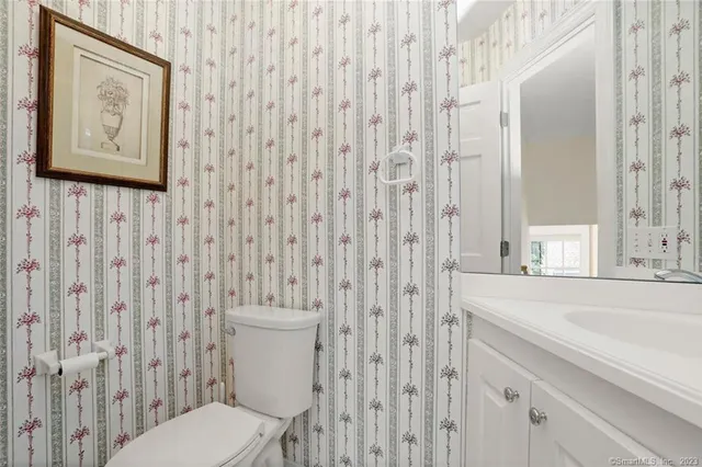 a bathroom with a toilet and a sink