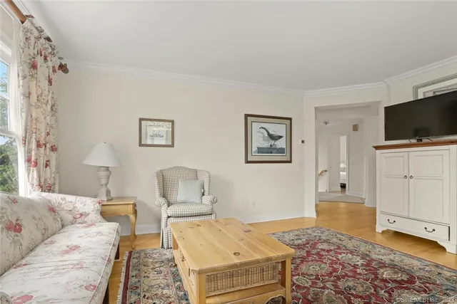 a bedroom with furniture and a flat screen tv