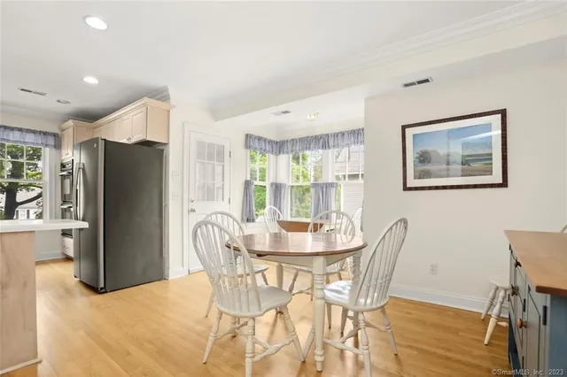 a dining room with furniture and window