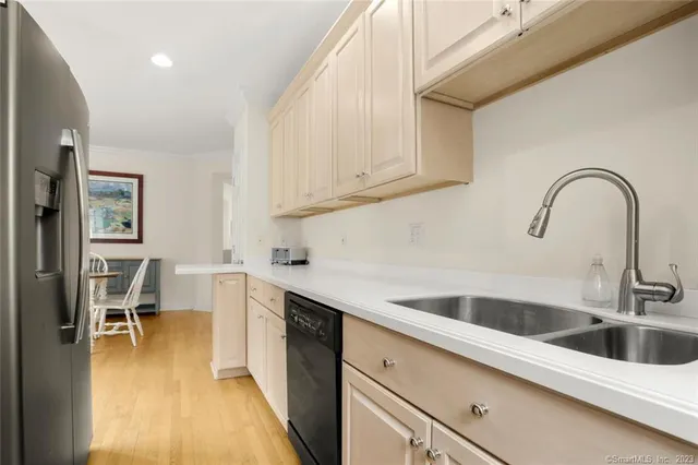 a kitchen with a sink and cabinets