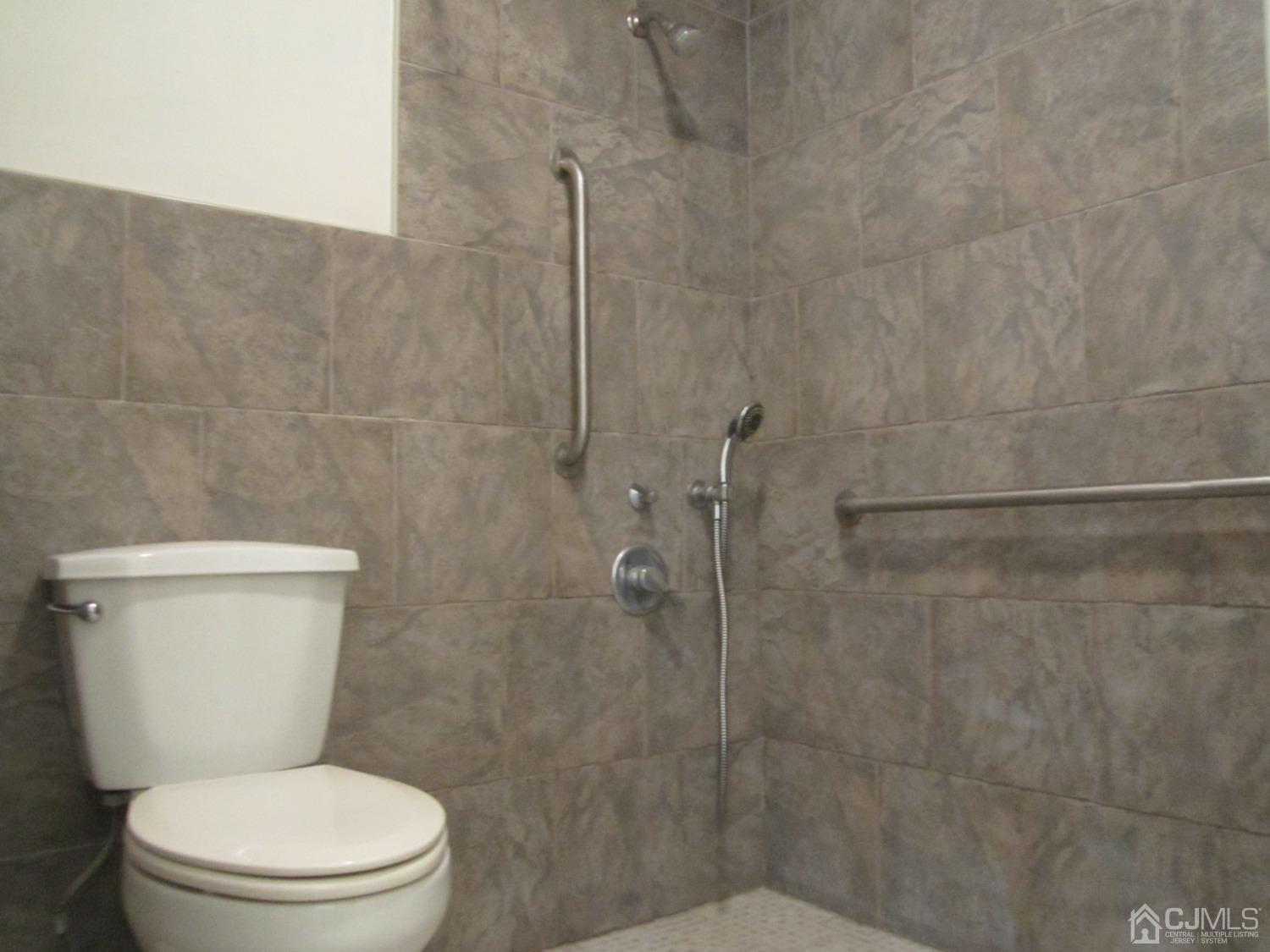 B Glen Road Monroe Township, NJ 08831 - Photo 5 of 28 a white toilet sitting next to a bath tub