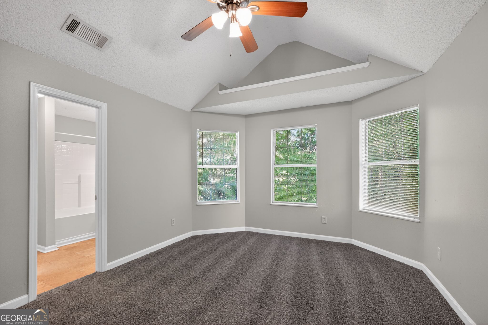2404 Raven Circle Lithonia, GA 30058 - Photo 13 of 38 a view of an empty room with a window