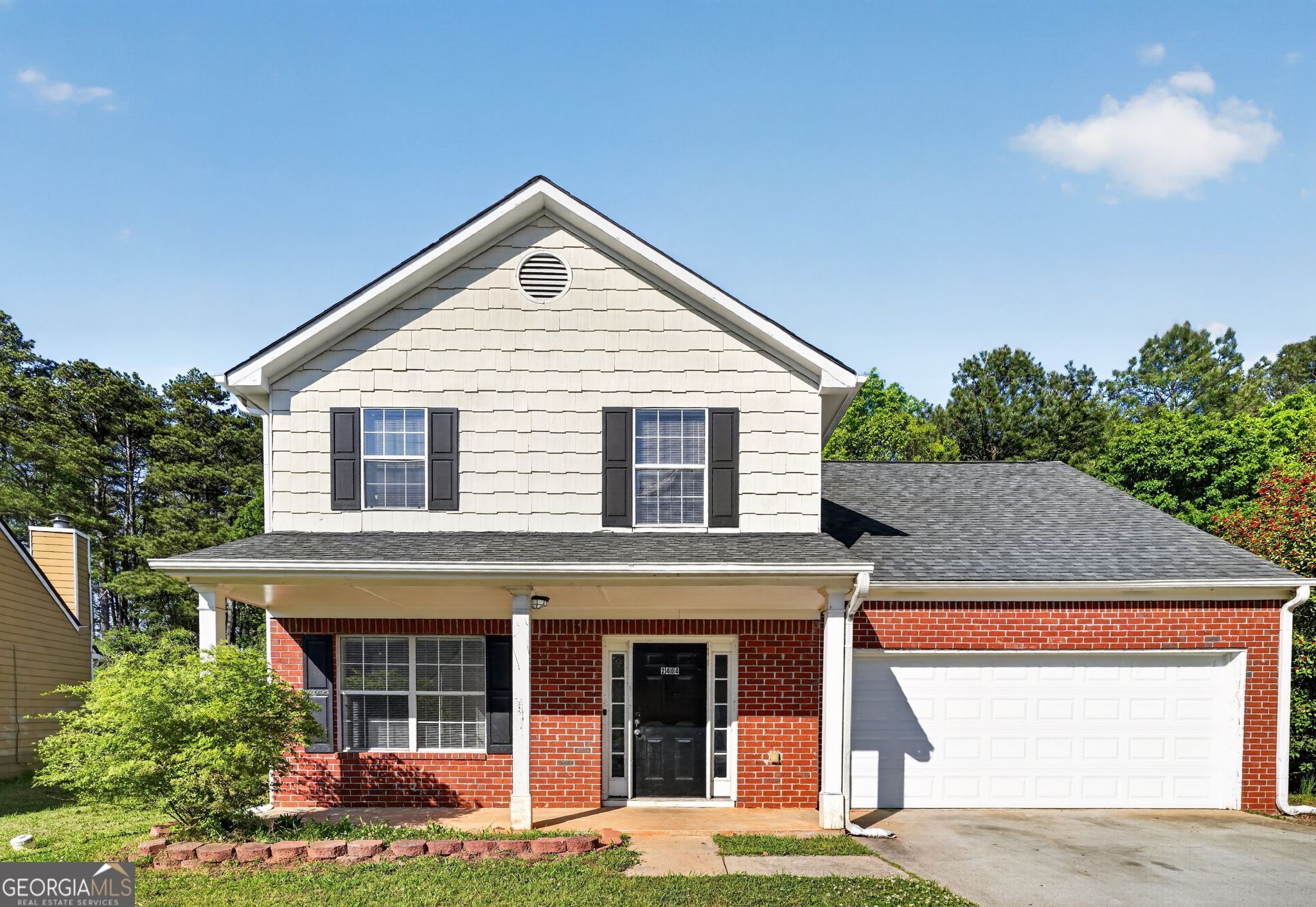2404 Raven Circle Lithonia, GA 30058 - Photo 2 of 38 a view of a house with yard and plants