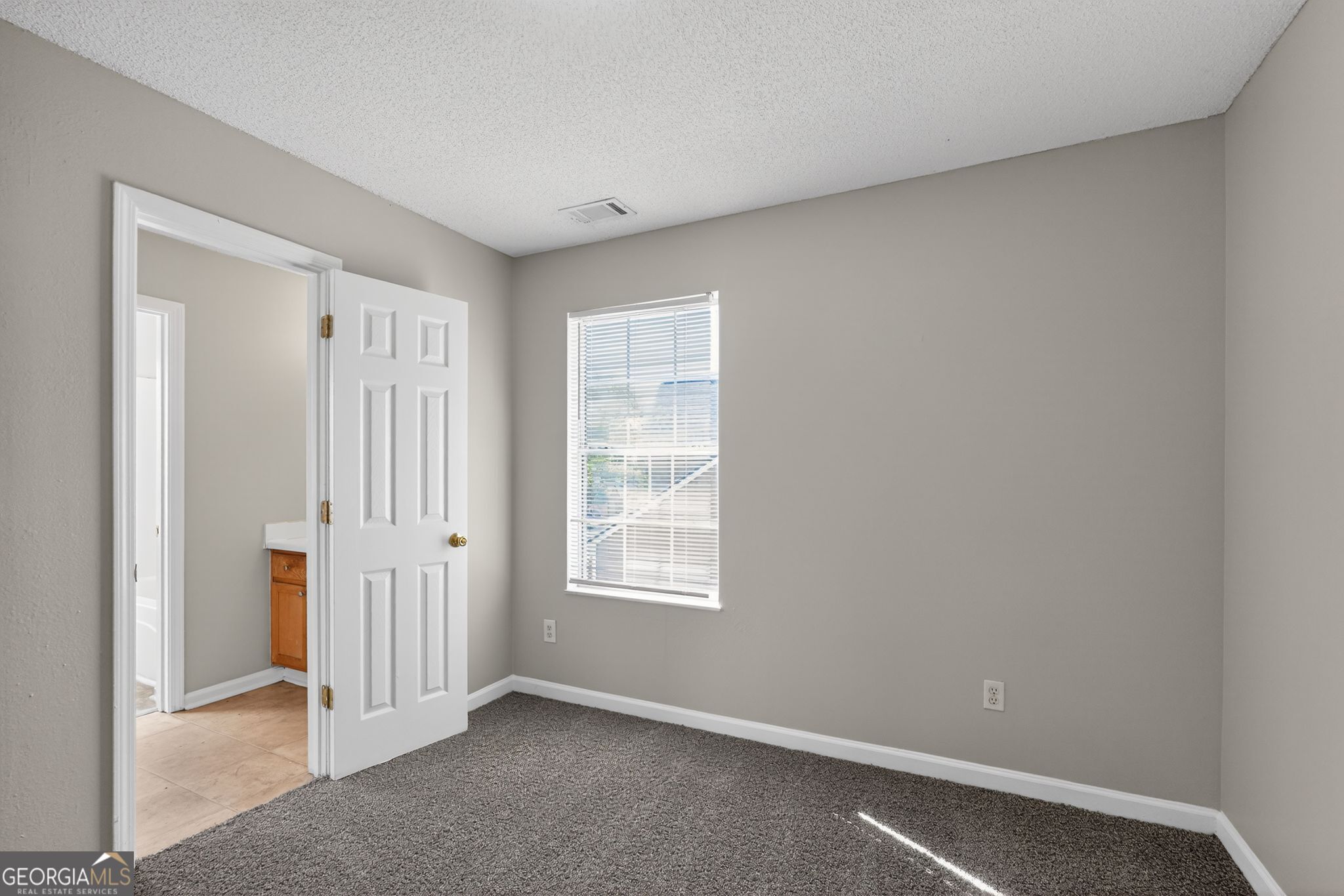2404 Raven Circle Lithonia, GA 30058 - Photo 25 of 38 an empty room with windows