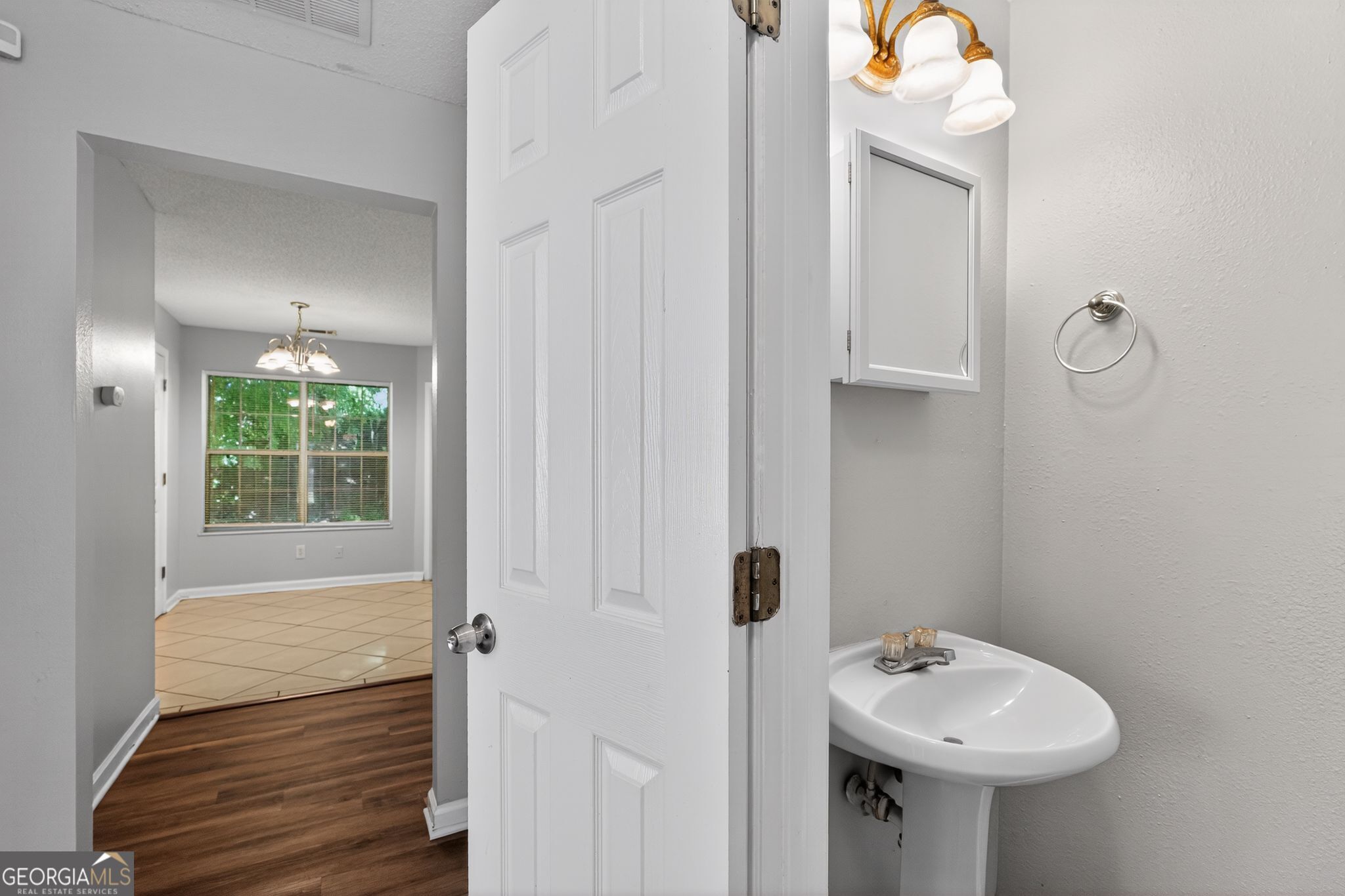 2404 Raven Circle Lithonia, GA 30058 - Photo 28 of 38 a bathroom with a sink a toilet and tub
