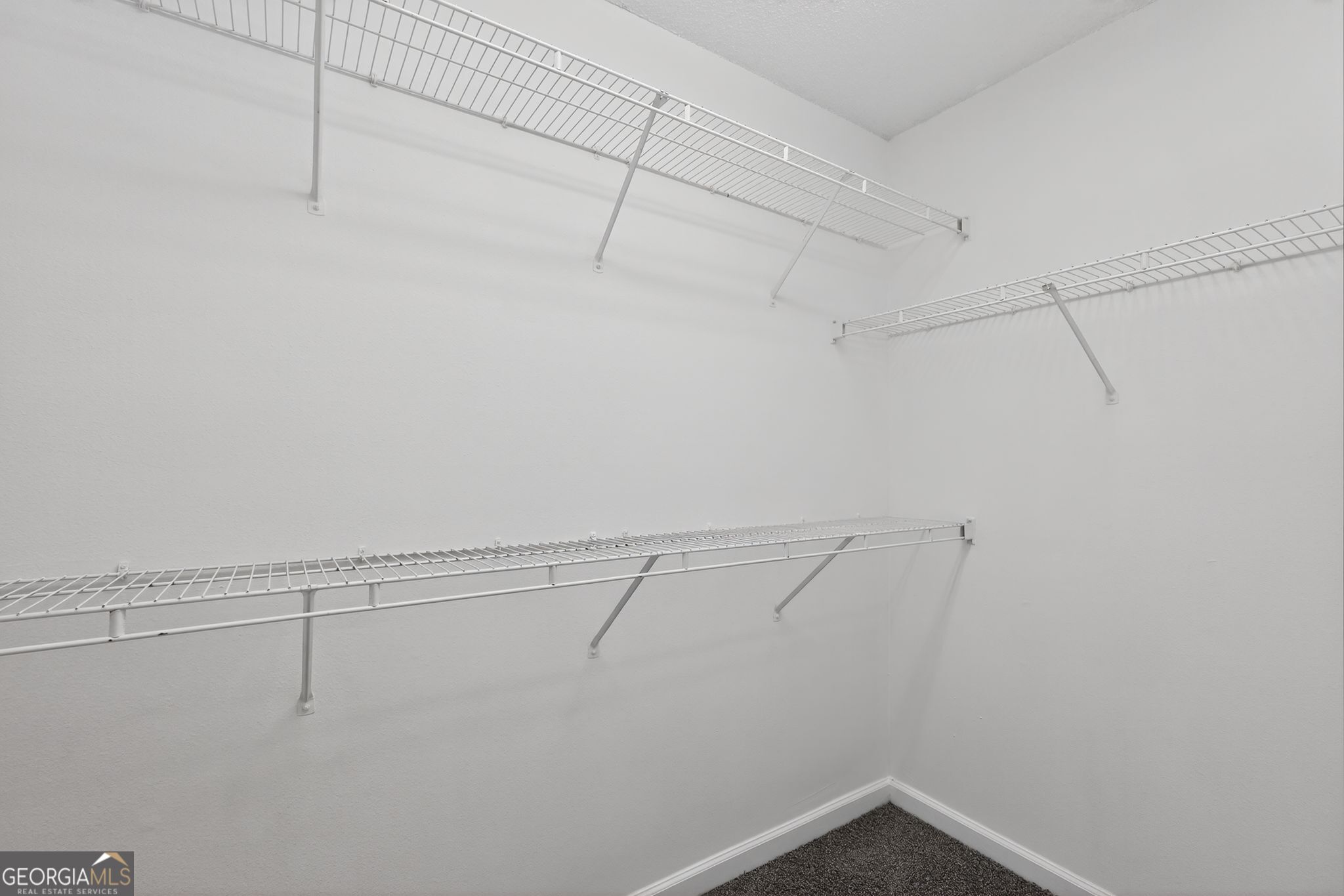 2404 Raven Circle Lithonia, GA 30058 - Photo 29 of 38 a view of a room with racks on the wall