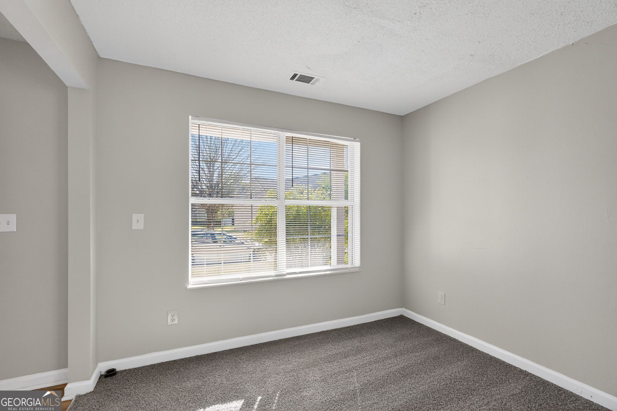 2404 Raven Circle Lithonia, GA 30058 - Photo 32 of 38 an empty room with a window