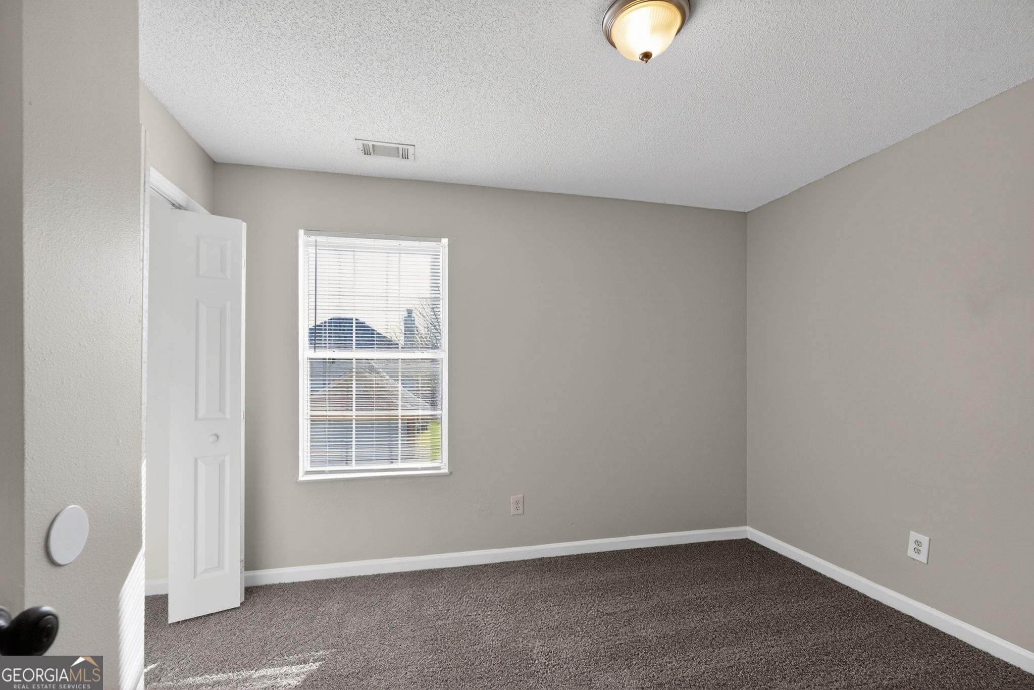 2404 Raven Circle Lithonia, GA 30058 - Photo 33 of 38 a view of an empty room with a window