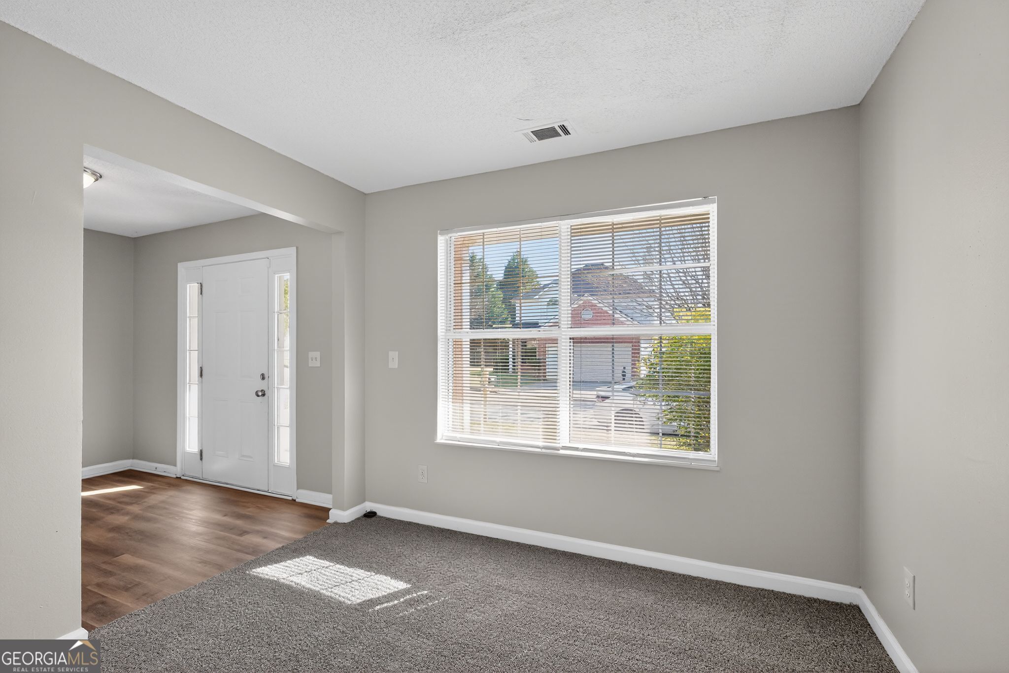 2404 Raven Circle Lithonia, GA 30058 - Photo 4 of 38 a view of an empty room with a window