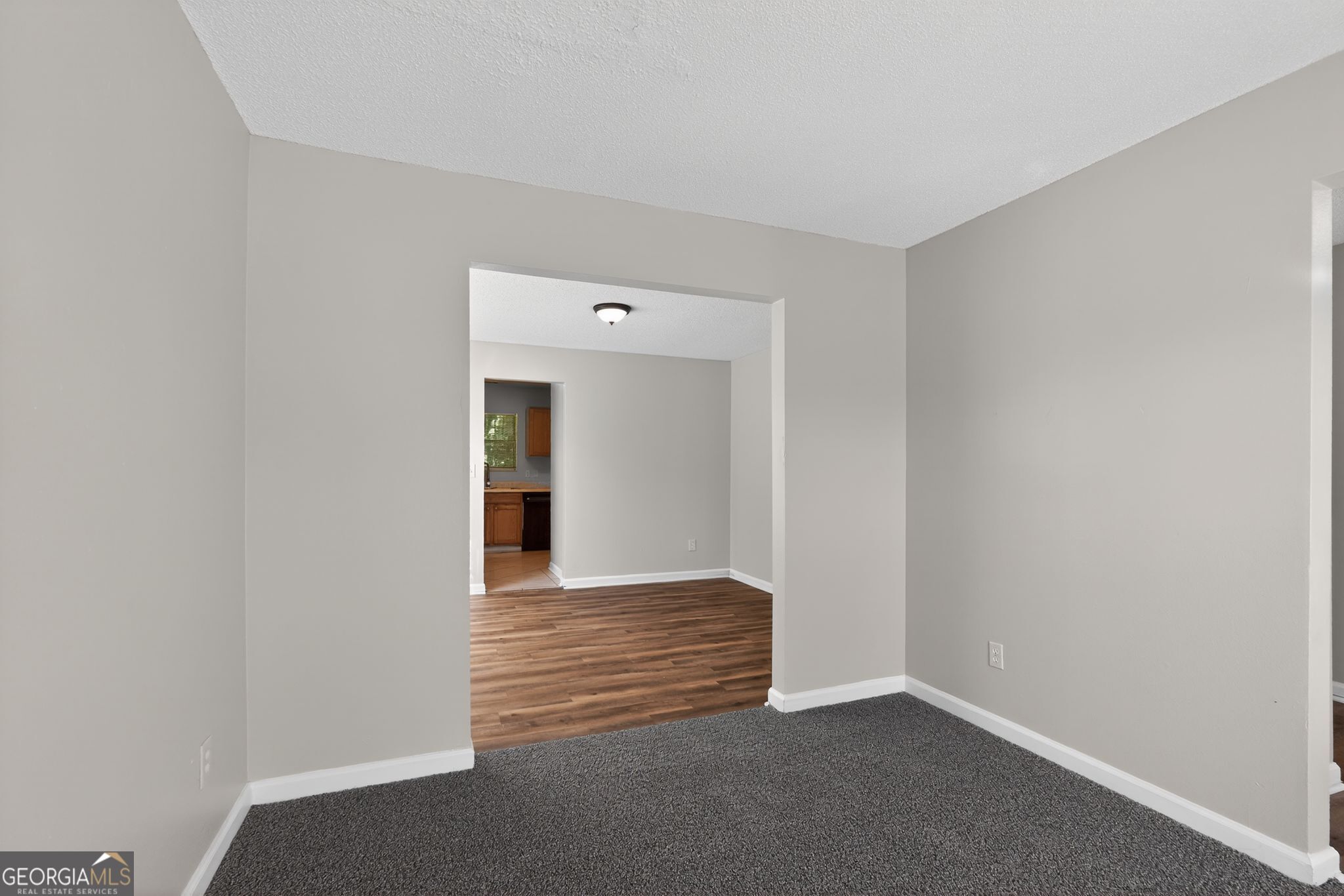 2404 Raven Circle Lithonia, GA 30058 - Photo 5 of 38 a view of an empty room with wooden floor