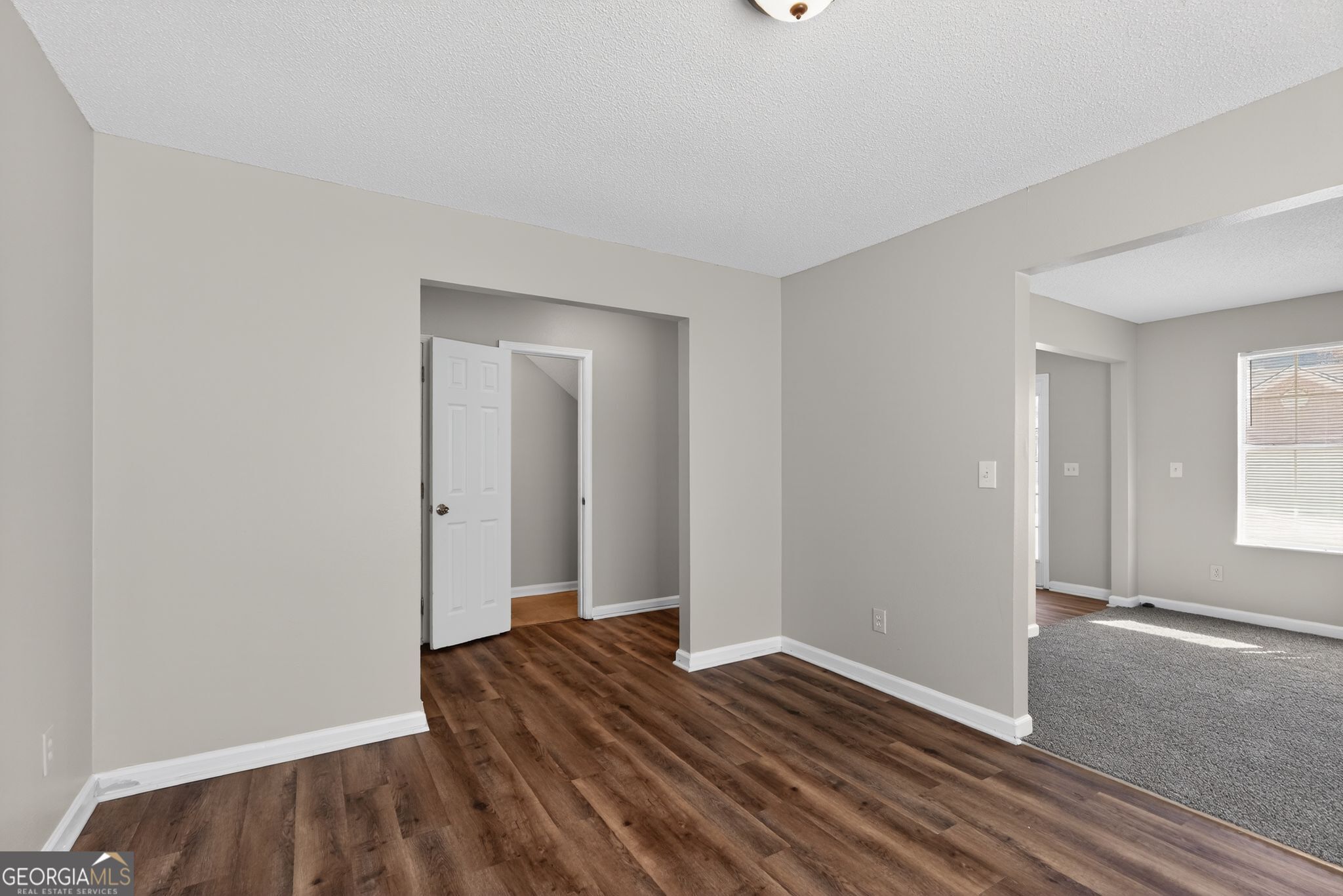 2404 Raven Circle Lithonia, GA 30058 - Photo 7 of 38 a view of a room with wooden floor and window