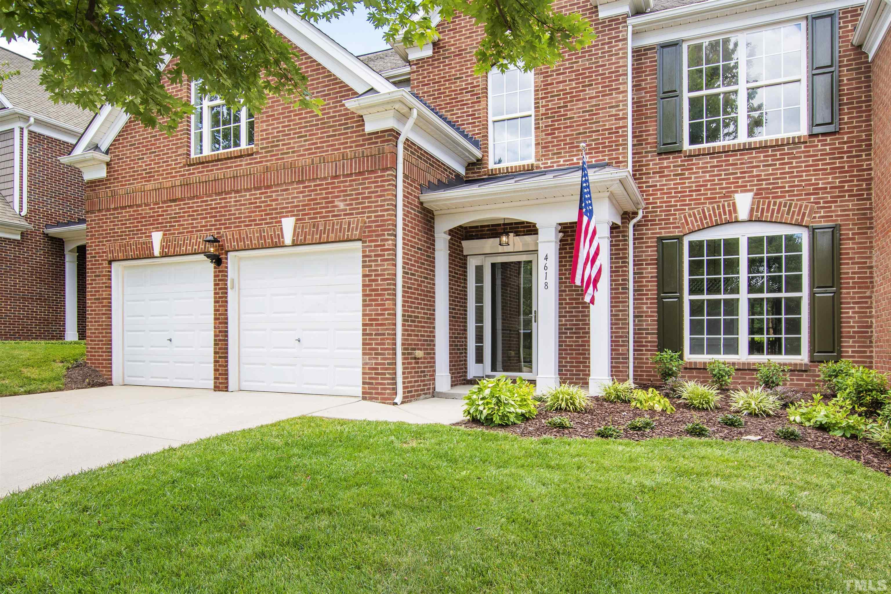 4618 Manassa Pope Lane Raleigh, NC 27612 - Photo 1 of 45 a front view of a house with garden