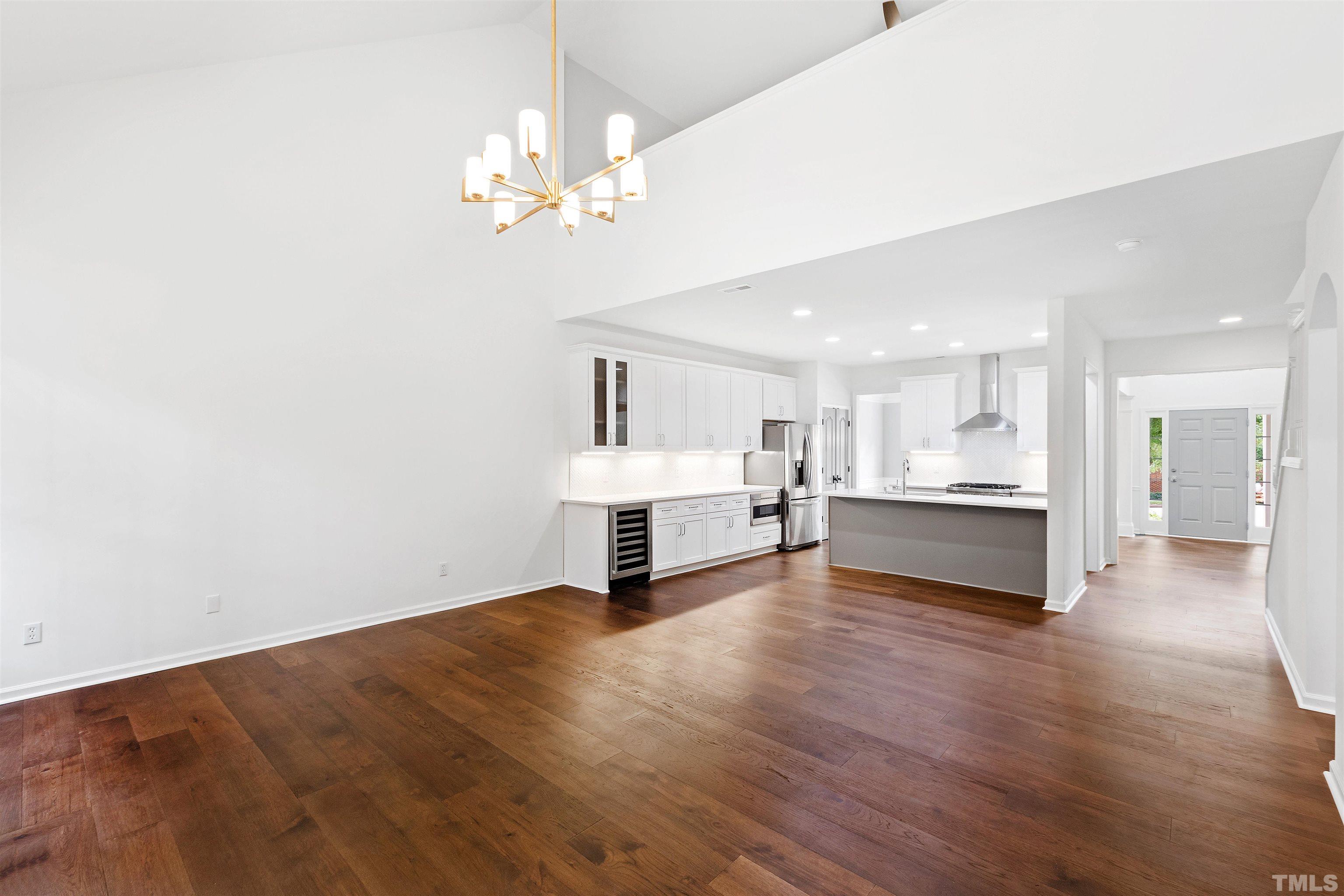 4618 Manassa Pope Lane Raleigh, NC 27612 - Photo 12 of 45 a view of a kitchen with furniture and a chandelier