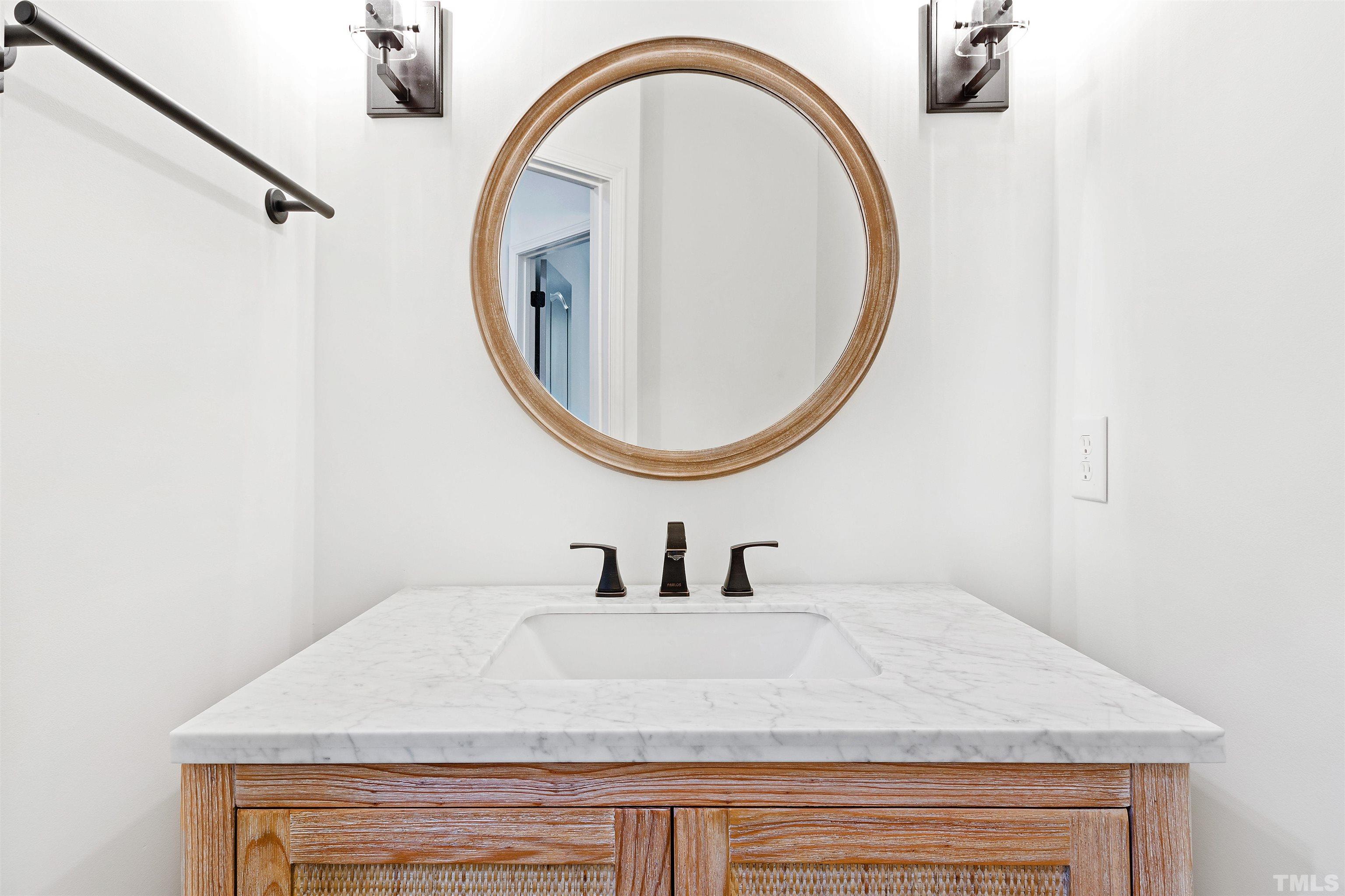 4618 Manassa Pope Lane Raleigh, NC 27612 - Photo 18 of 45 a bathroom with a sink and a mirror