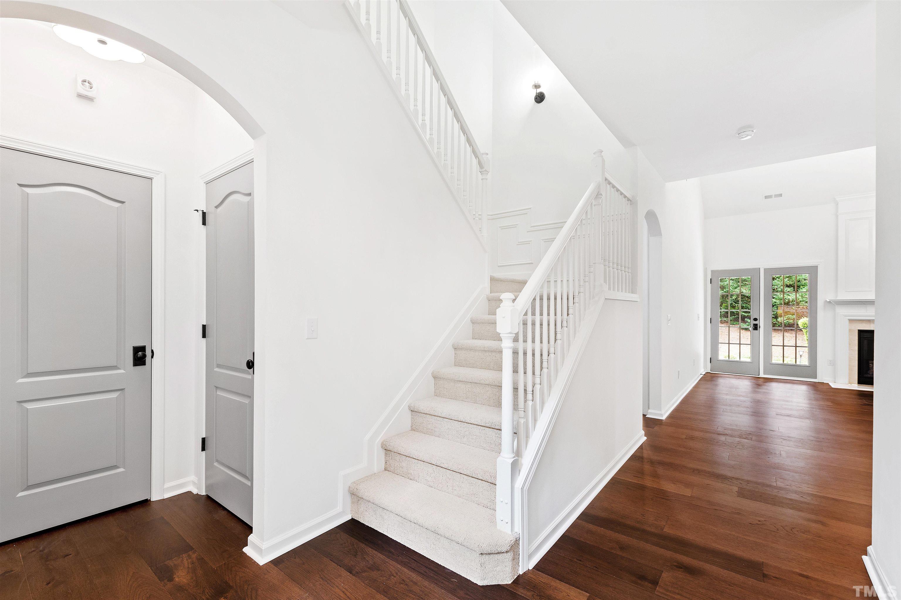 4618 Manassa Pope Lane Raleigh, NC 27612 - Photo 2 of 45 a view of entryway with wooden floor and stairs