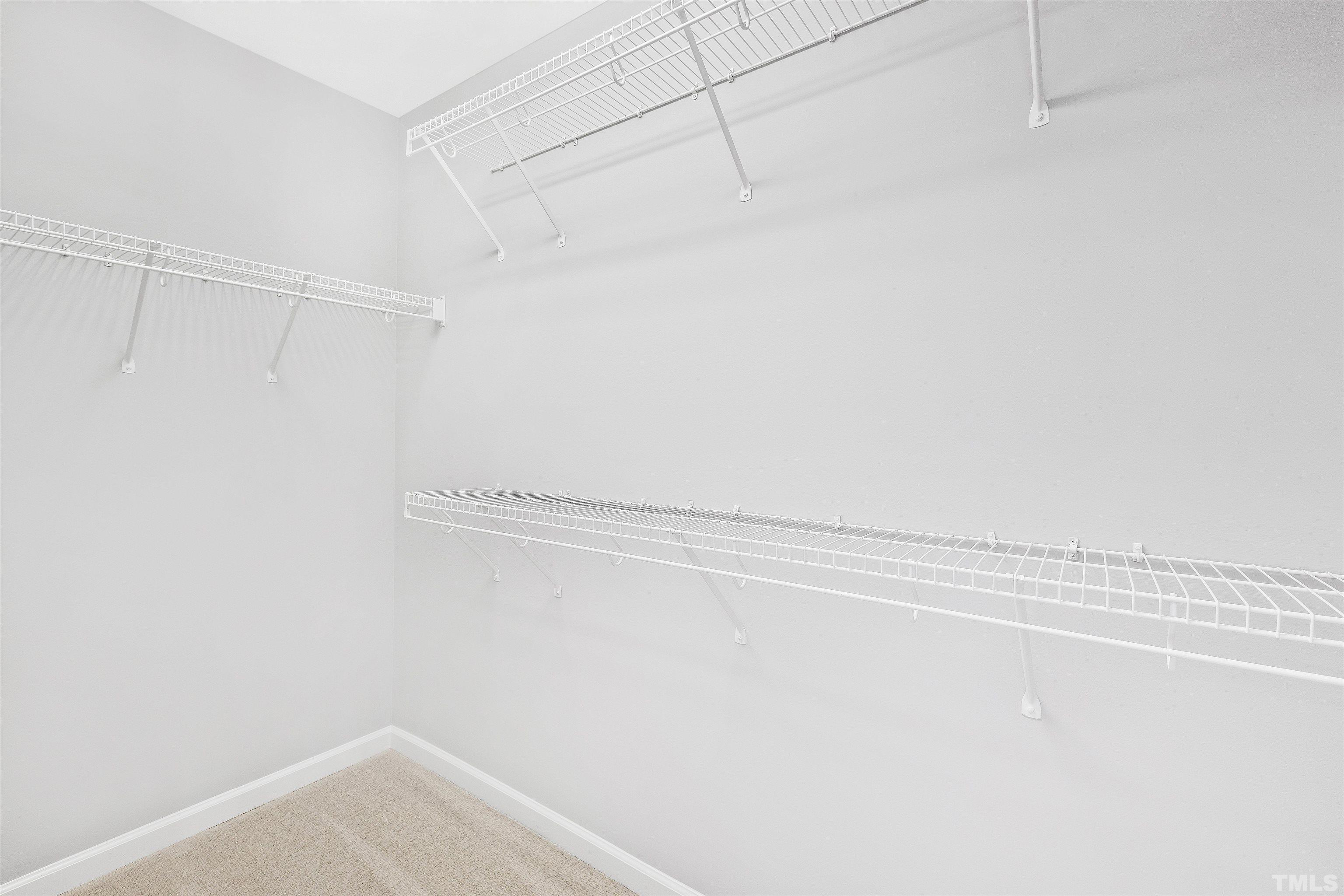 4618 Manassa Pope Lane Raleigh, NC 27612 - Photo 21 of 45 a view of a room with racks on the wall