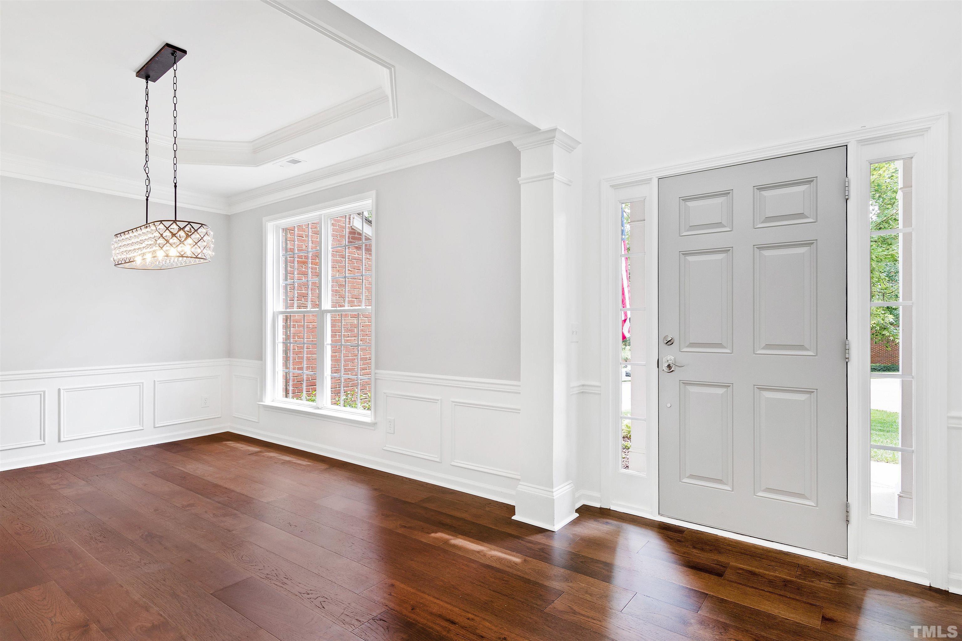 4618 Manassa Pope Lane Raleigh, NC 27612 - Photo 3 of 45 a view of empty room with wooden floor and window