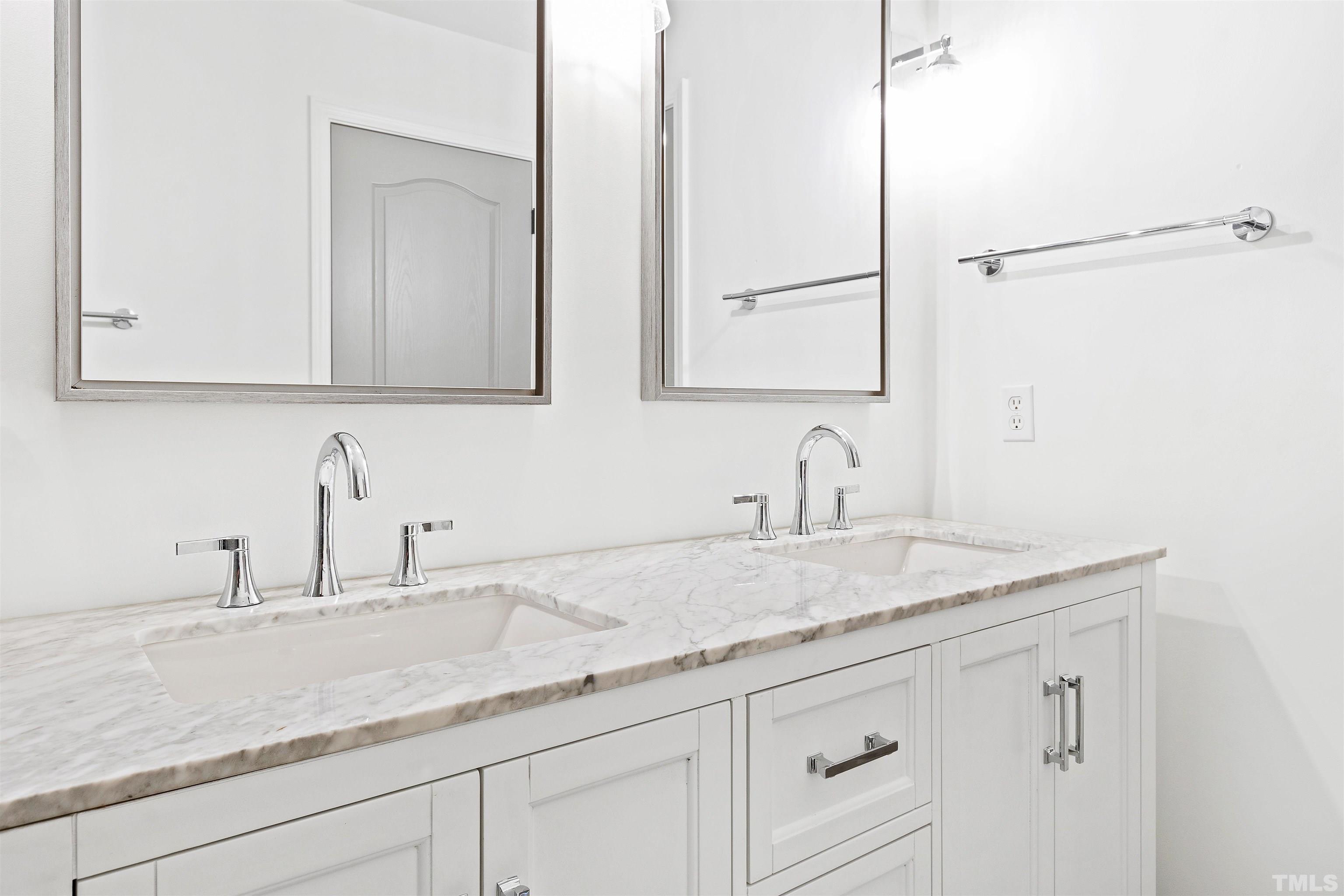 4618 Manassa Pope Lane Raleigh, NC 27612 - Photo 36 of 45 a bathroom with a sink and a mirror