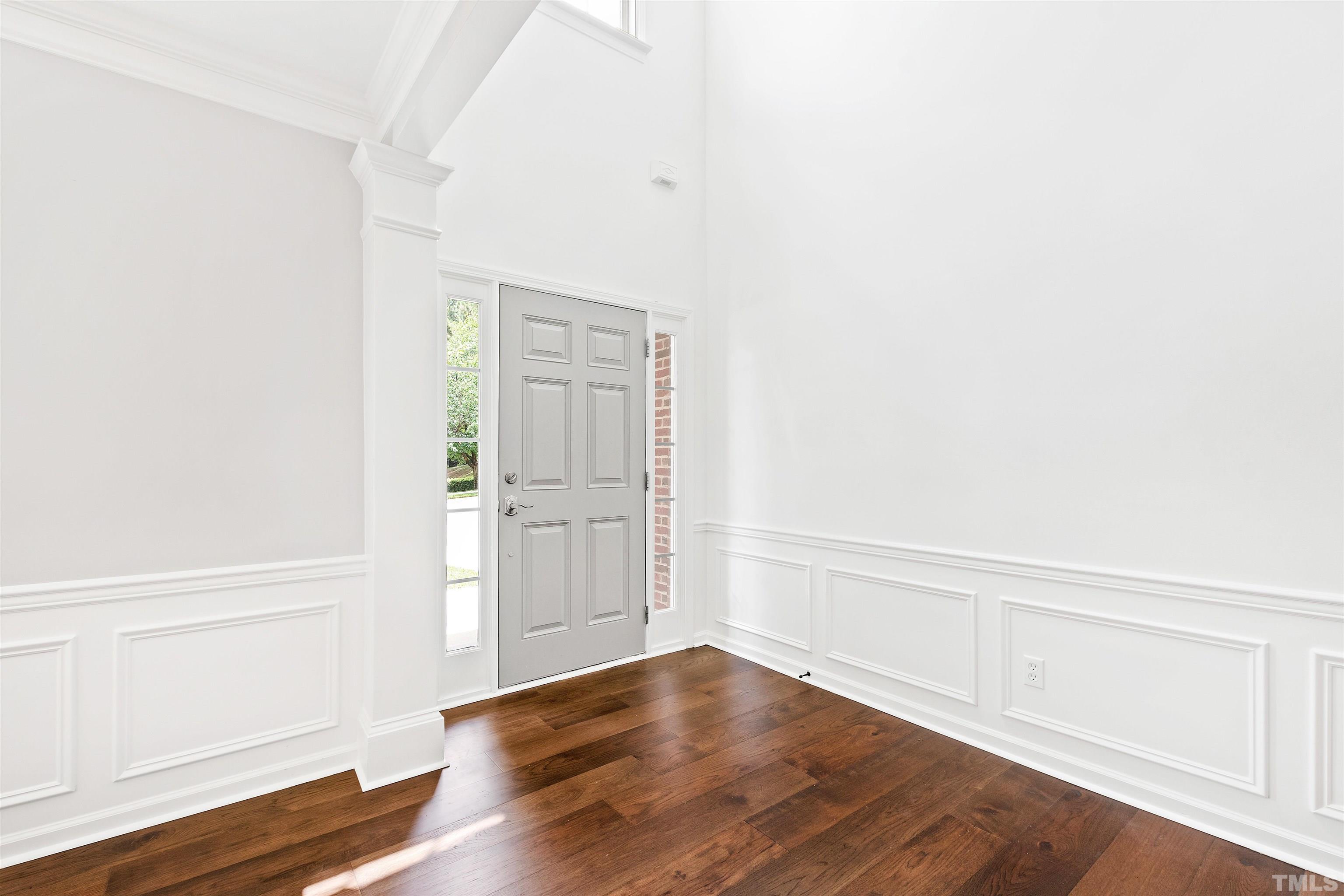 4618 Manassa Pope Lane Raleigh, NC 27612 - Photo 4 of 45 a view of an empty room with wooden floor