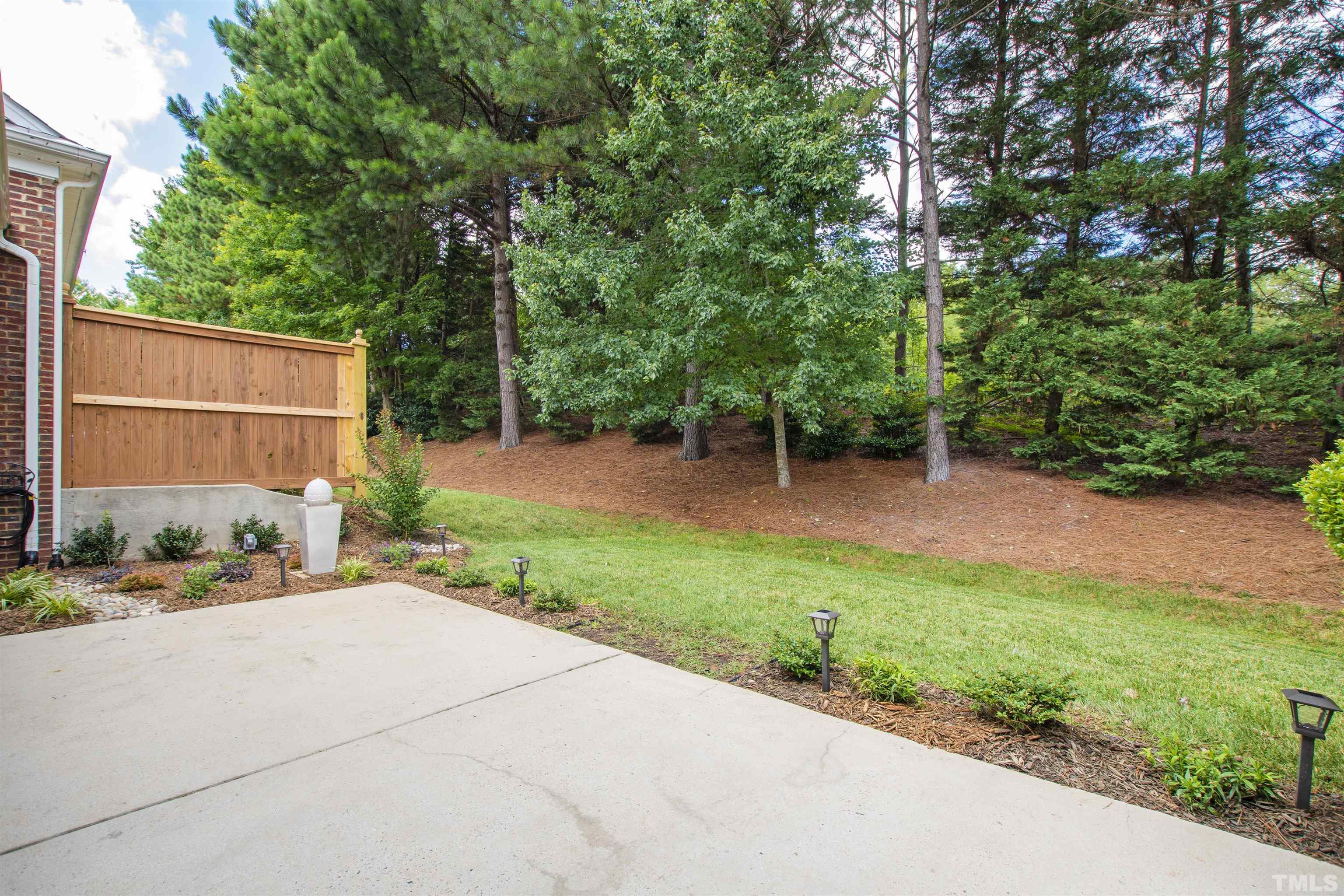 4618 Manassa Pope Lane Raleigh, NC 27612 - Photo 41 of 45 a view of a backyard with a garden