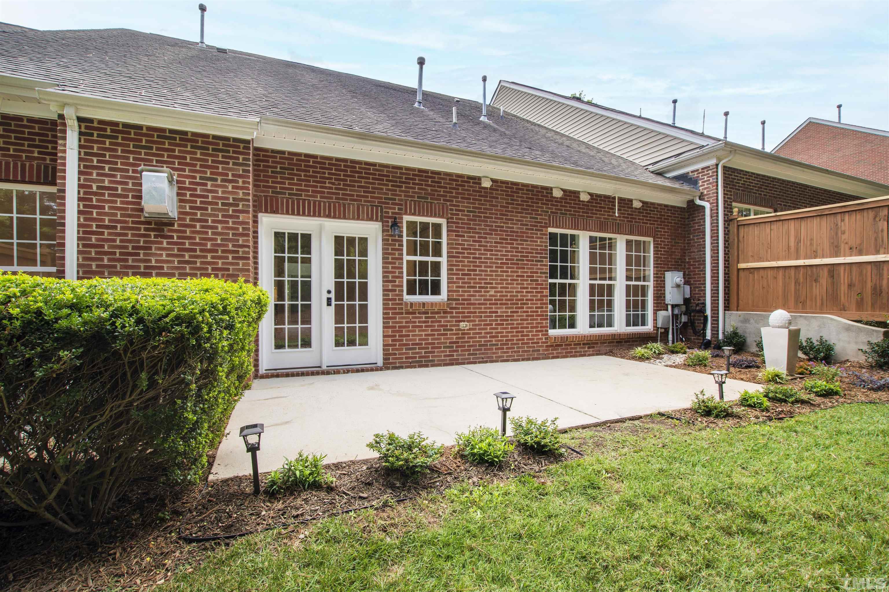 4618 Manassa Pope Lane Raleigh, NC 27612 - Photo 43 of 45 a front view of a house with garden