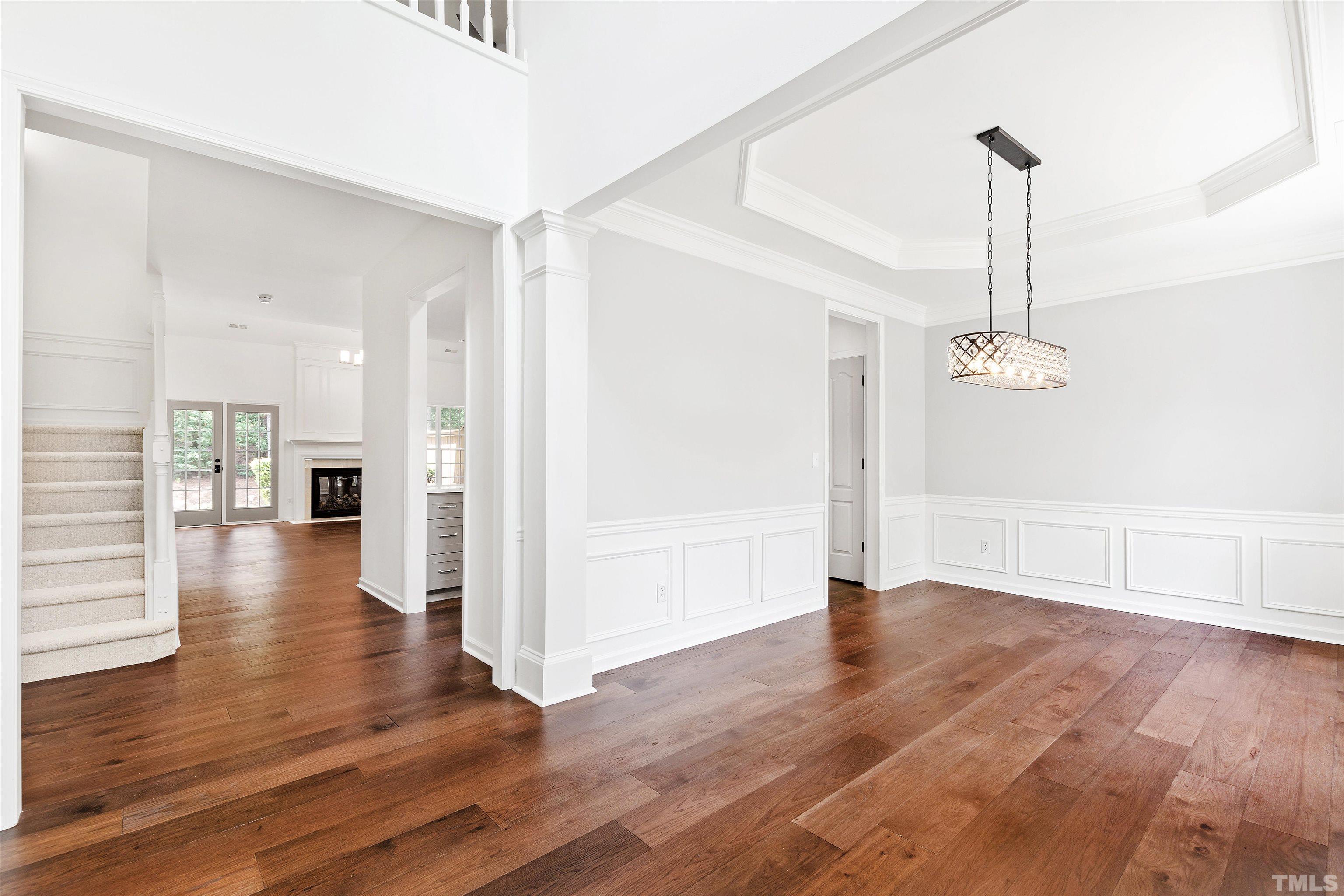 4618 Manassa Pope Lane Raleigh, NC 27612 - Photo 5 of 45 wooden floor in an empty room with a window