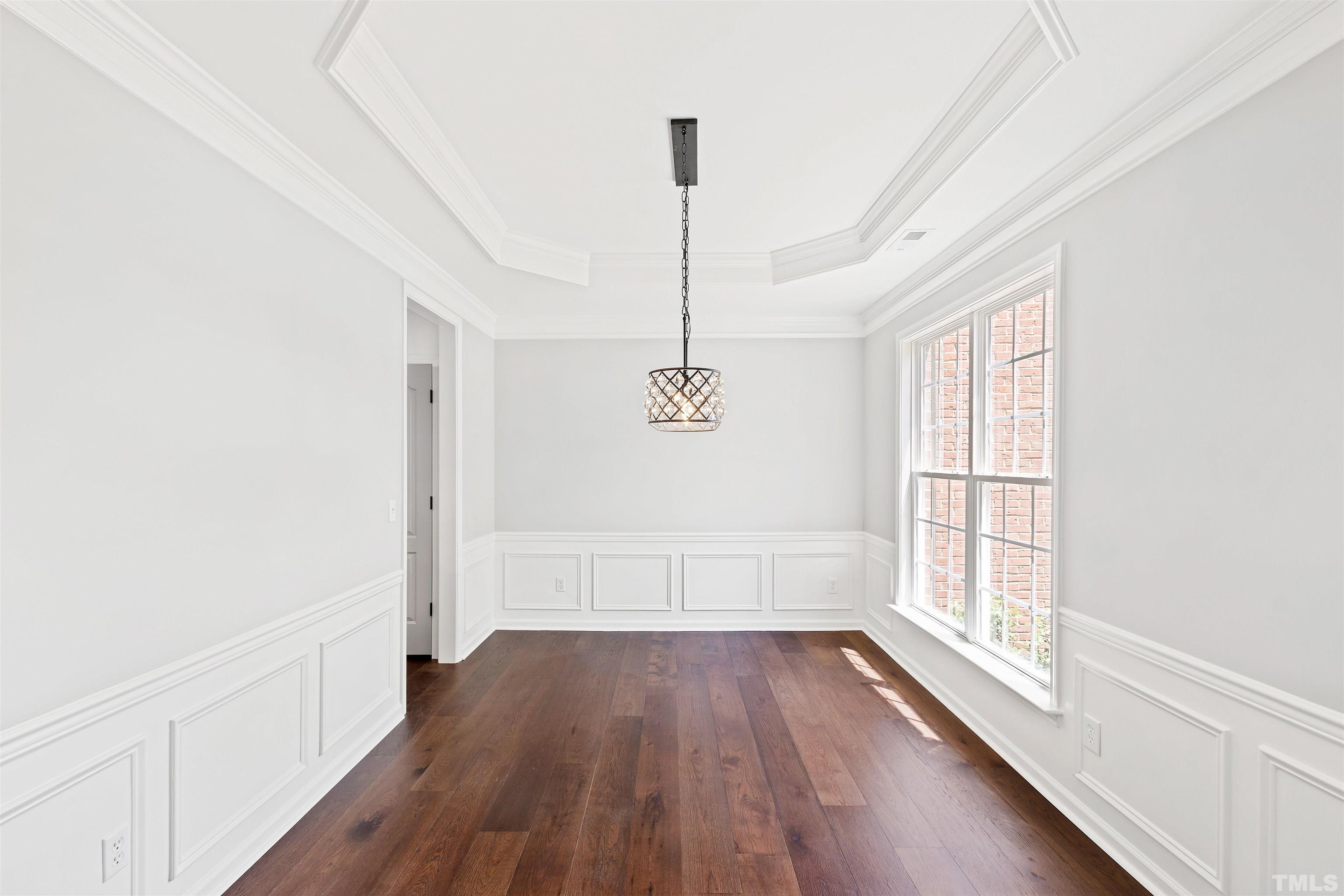 4618 Manassa Pope Lane Raleigh, NC 27612 - Photo 8 of 45 a view of empty room with wooden floor and fan