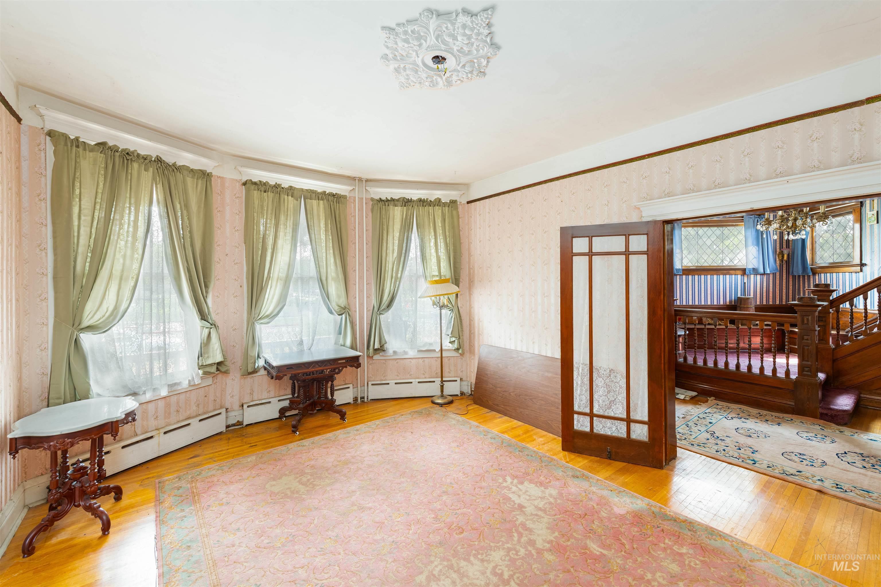 507 7th Avenue Lewiston, ID 83501 - Photo 16 of 30 Unfurnished room with light wood-style flooring and wallpapered walls
